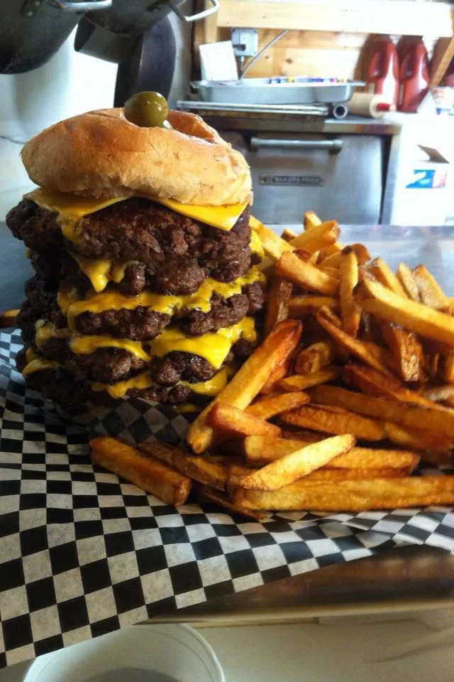 Gronk's Enger Tower Challenge, a tall stack of patties and cheese beside a pile of fries